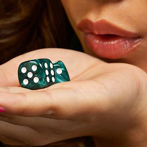 Girl Blowing on the Dice